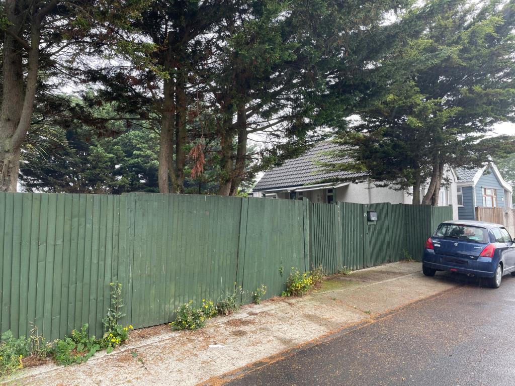 Lot: 30 - VACANT TWO-BEDROOM CHALET ON DOUBLE PLOT - Street view from the road of 45 Alvis Avenue